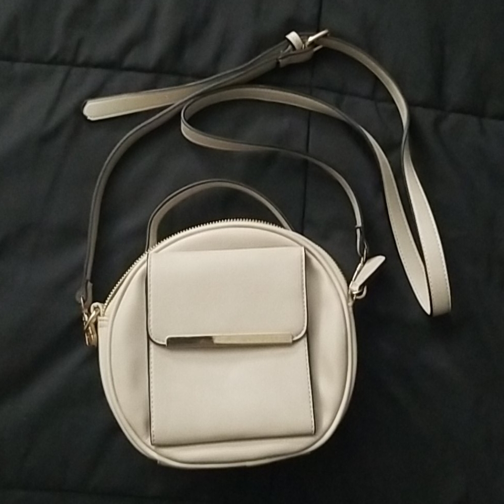 Round beige crossbody purse